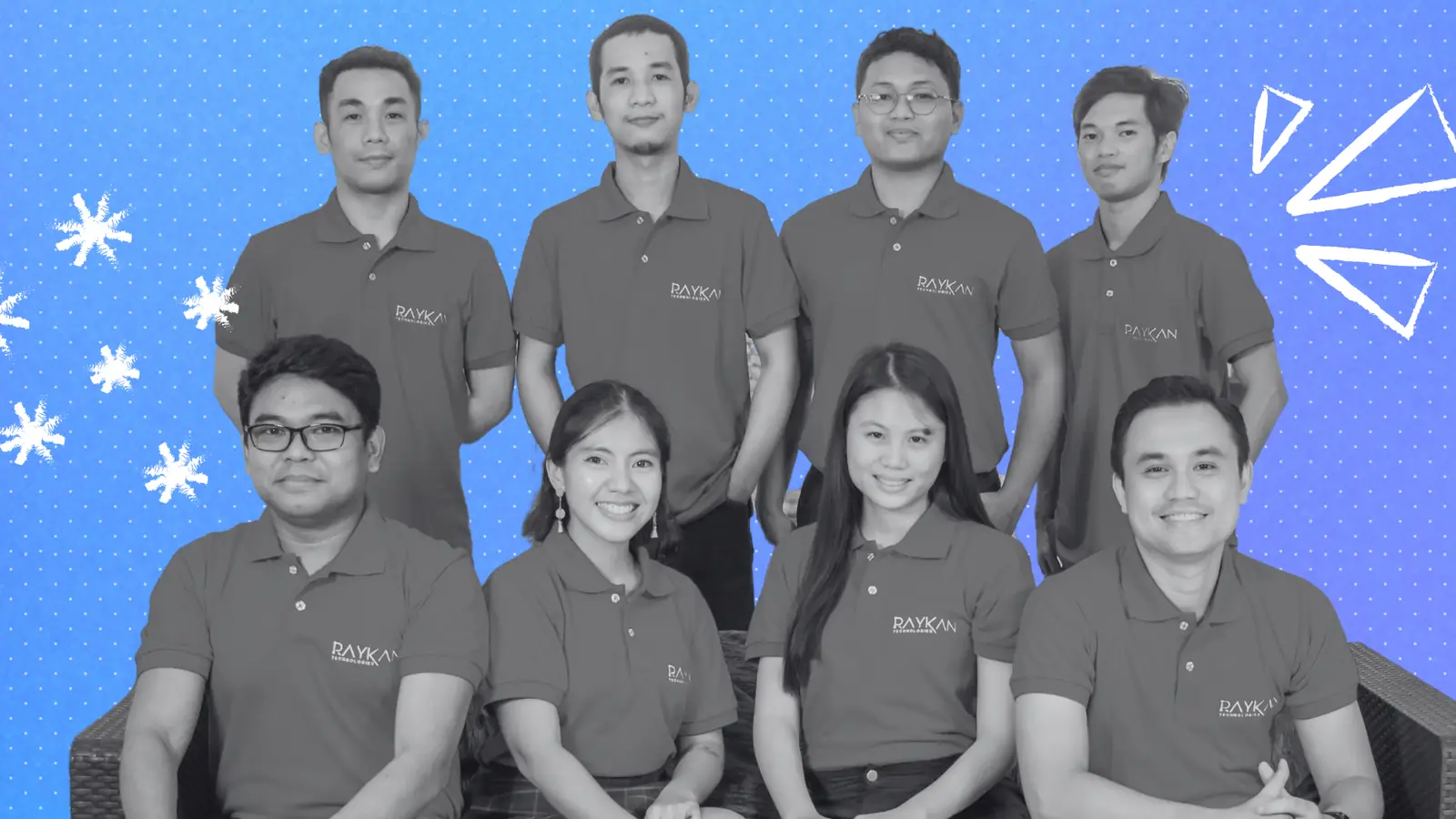 The Raykan Technologies team in company shirts, posing together
